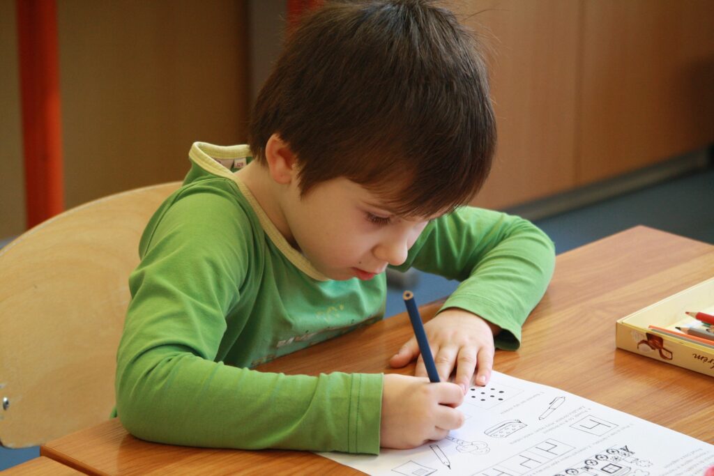 A child with ADHD working in a classroom