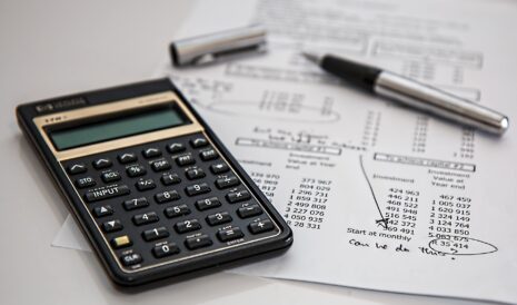 A calculator and a pen, used along with our fostering allowance calculator