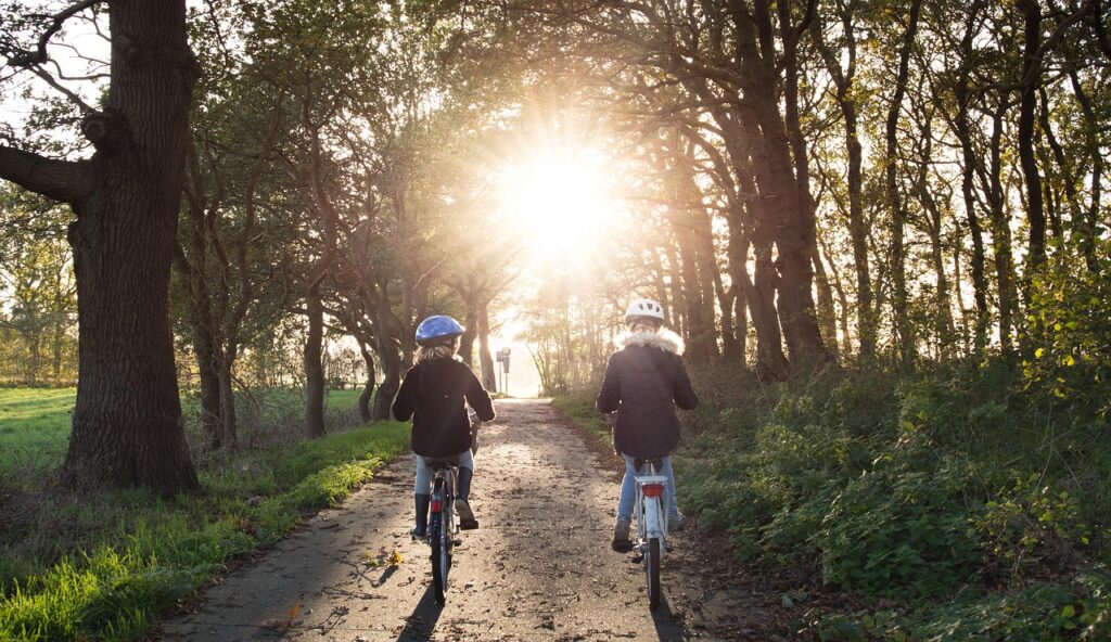 Two young people going on a bike ride