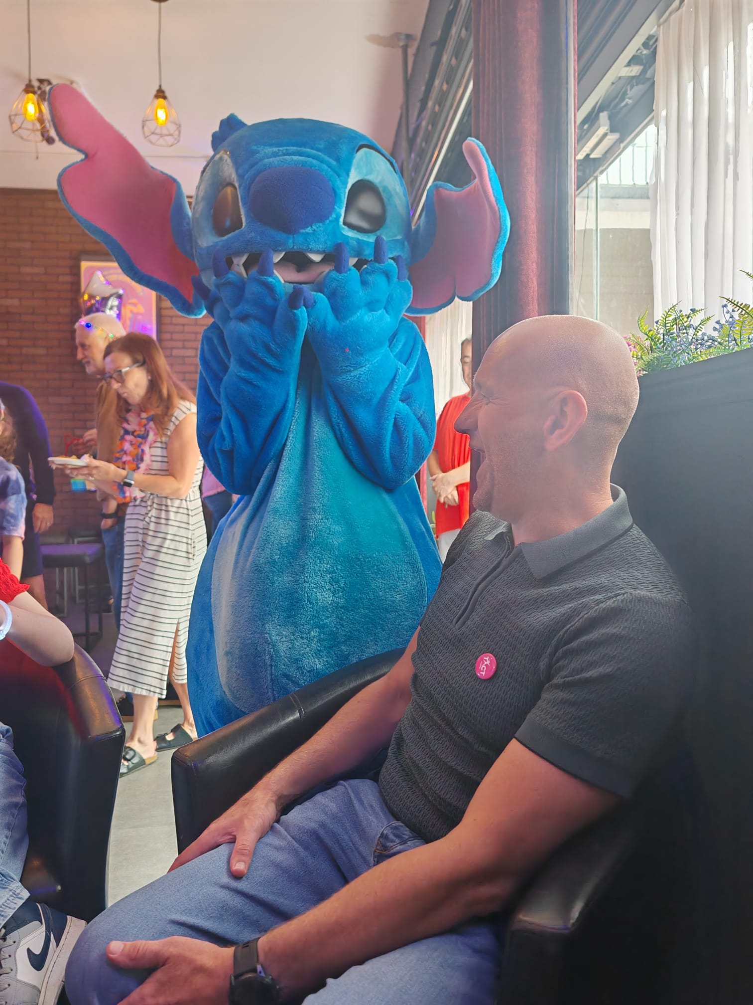 Stitch surprising one of our carers at a wellbeing event