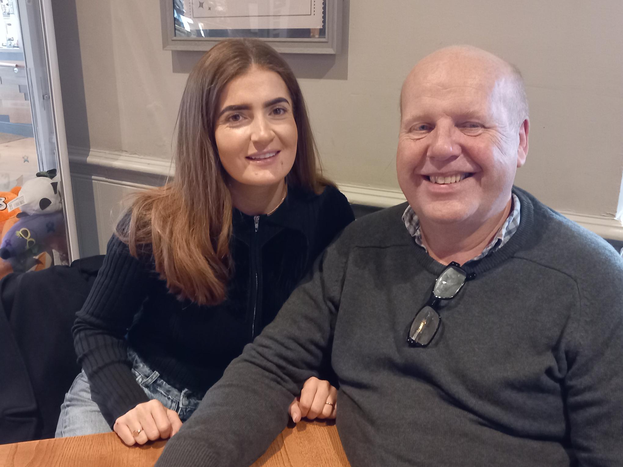 Two TACT foster carers smiling on one of our wellbeing events