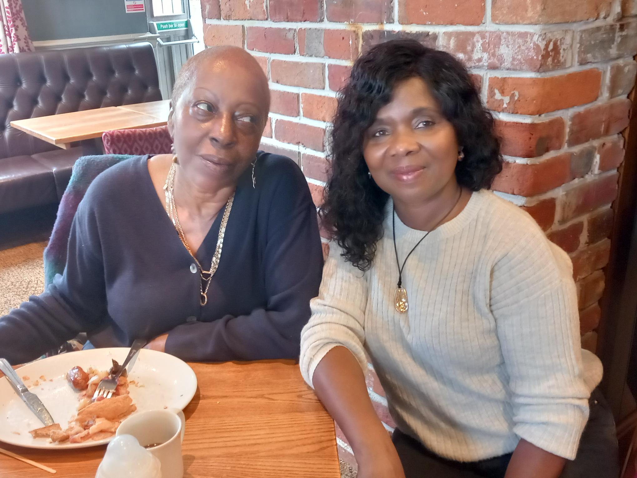 Two foster carers enjoying a wellbeing breakfast