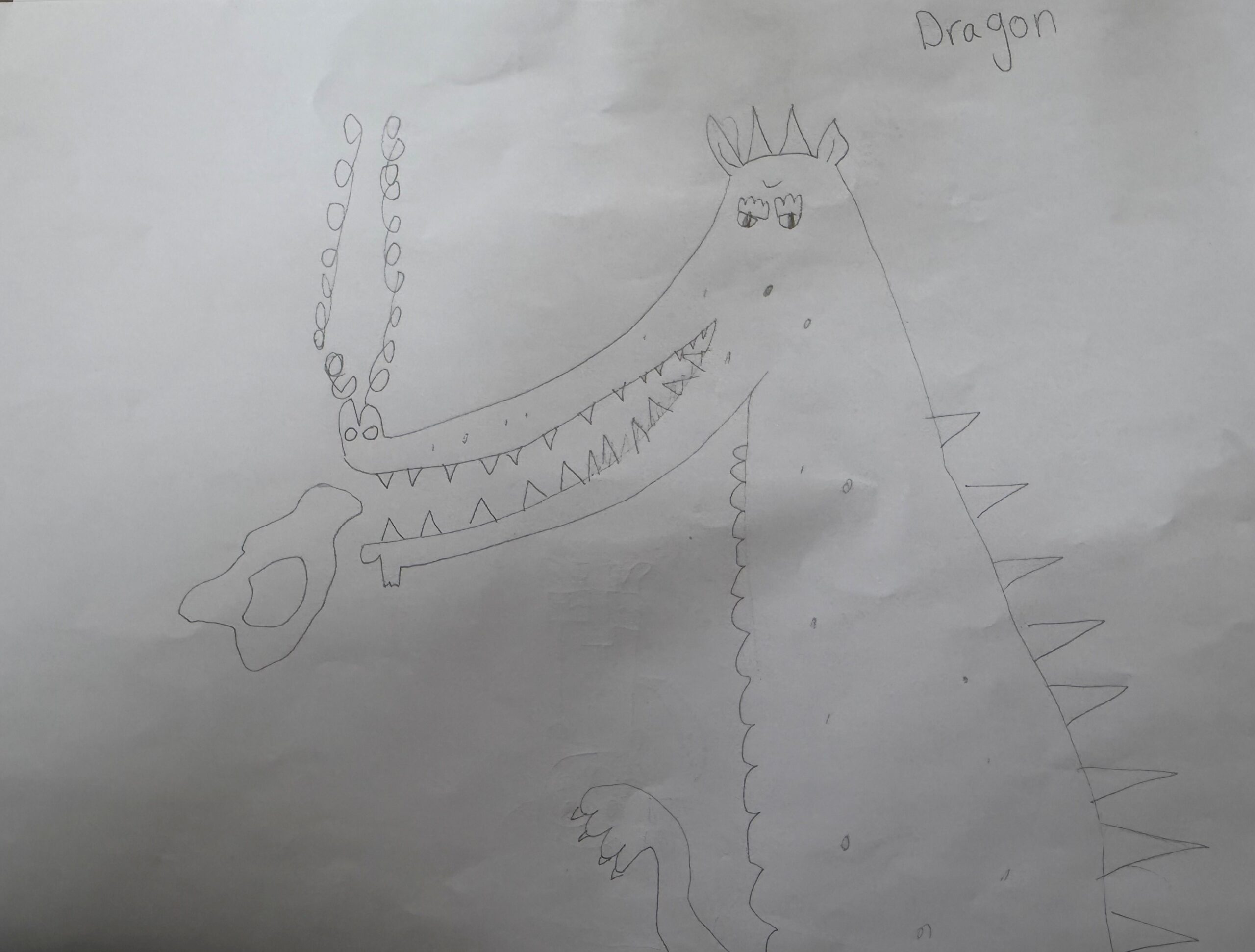 A young person's drawing of a dragon