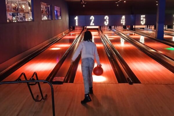 A young person bowling