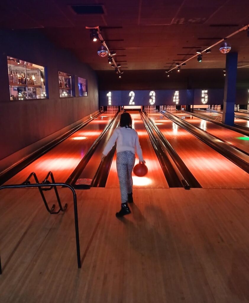 A young person bowling