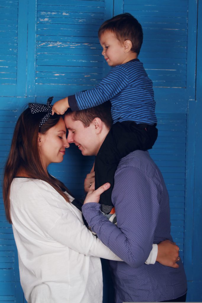 Two adults who have adopted a boy