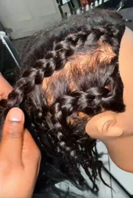 A TACT young person showing the finished plait