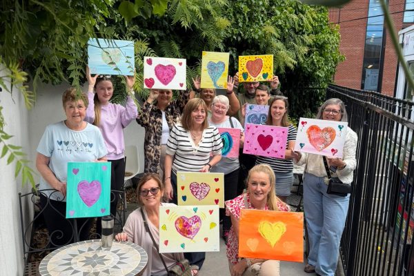 TACT foster carers showing their finished art