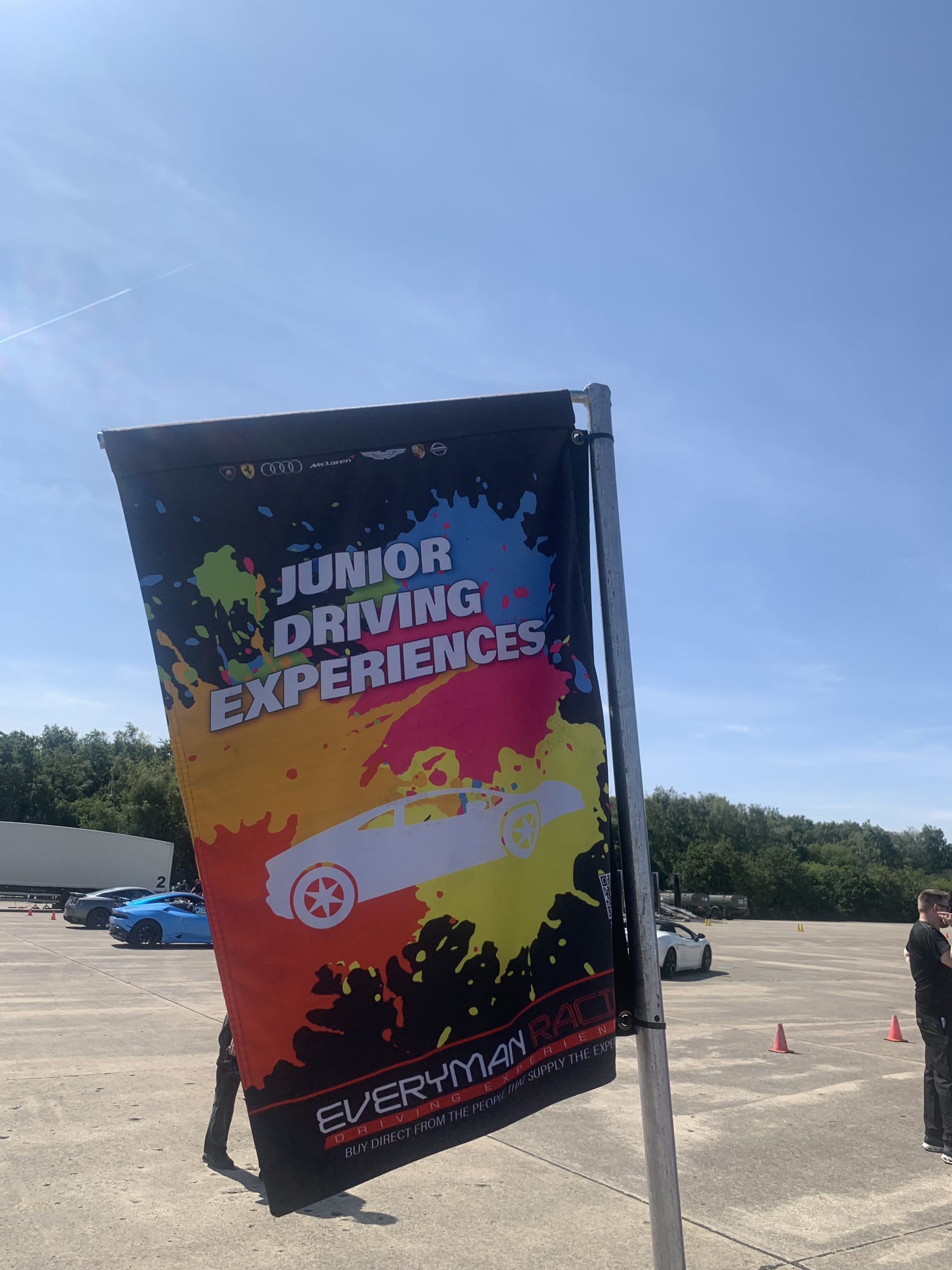 A junior driving experiences flag
