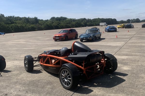 A red sports car being driven