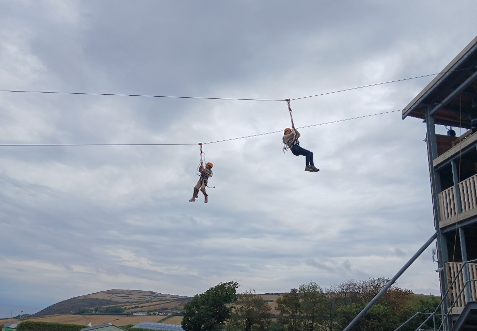 Some young people on a zipwire